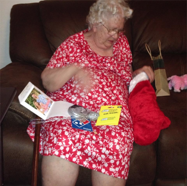 Mom quickly got into the spirit as she opened cards and emptied her stocking.